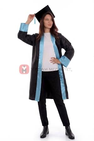 Graduate in cap and gown pose